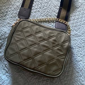 A cross body bag with a long strap and a smaller one. :)
